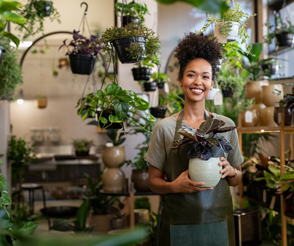 A woman in her small business, a plant shop.